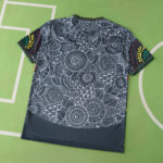 7dfd3fbb | UAE SPORT STORE Dark fabric with dense white mandala floral pattern spread on a green background.