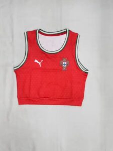 7e9fdc3b-2f46-4ff4-95c4-deea73a27c12 | UAE SPORT STORE Red Portugal national team basketball jersey front view, sleeveless crop top with white/green trim and PUMA logo on the chest