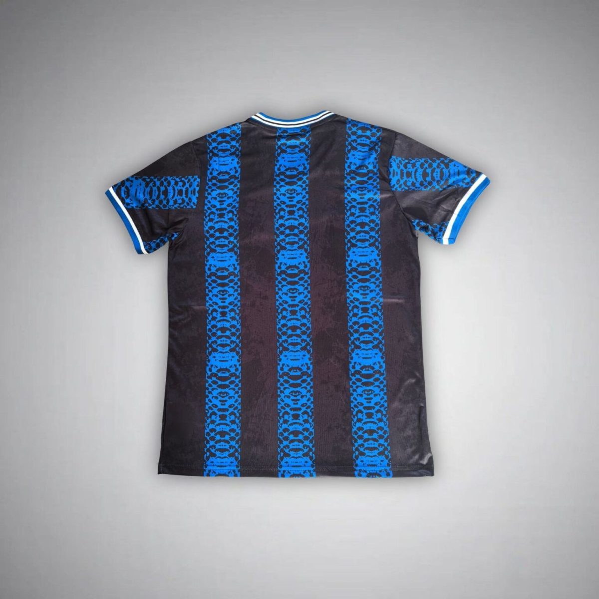 Back view of a black jersey with bright blue vertical stripes and white-trimmed blue collar and sleeves.