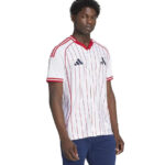 Male model wearing a white pinstripe jersey with red trim and blue pants (front view).