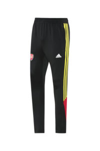 Black Adidas track pants with yellow side stripes and an Arsenal crest on the left thigh/hip area