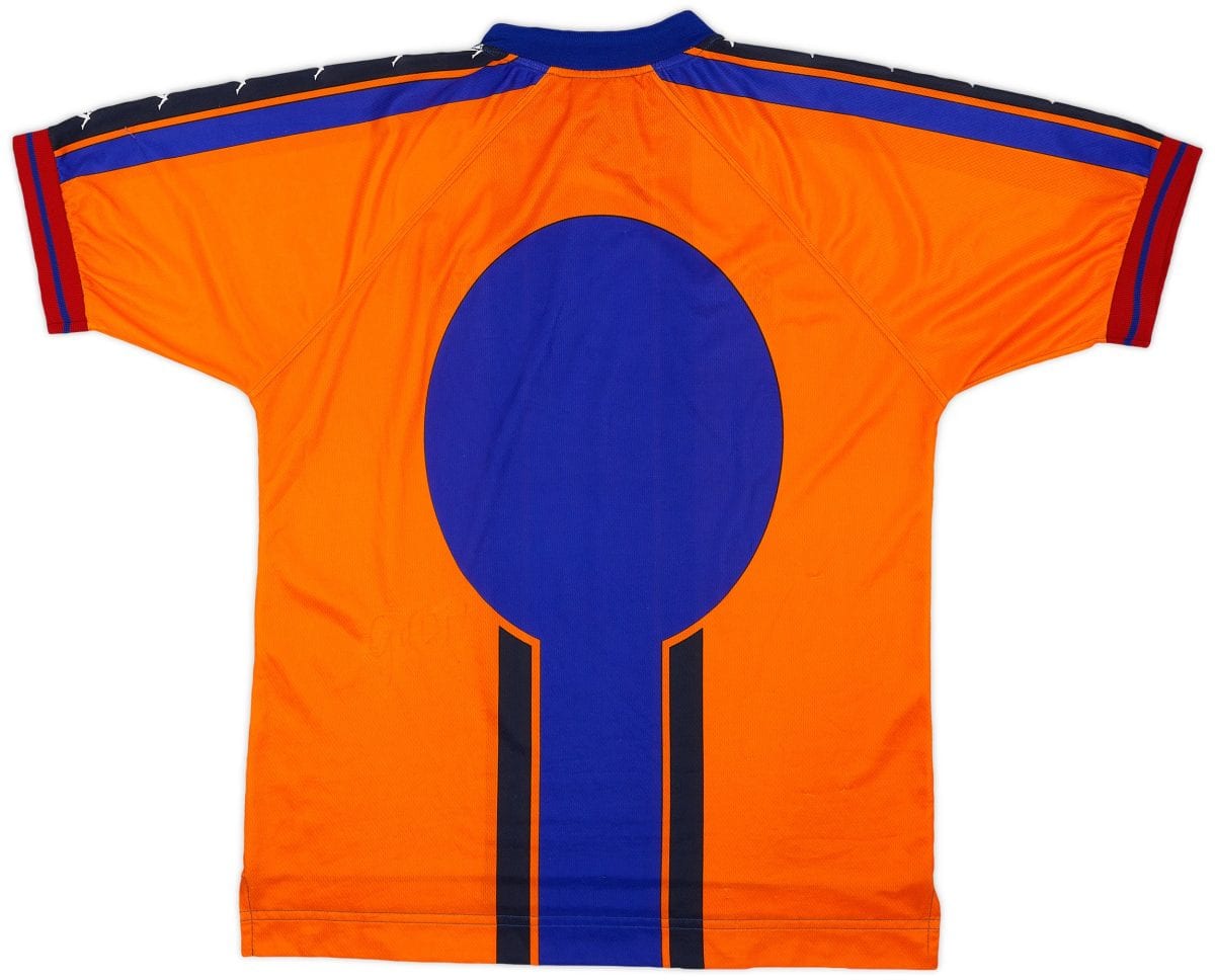 Back view of an orange sports jersey with large blue circular design and blue shoulder stripes.