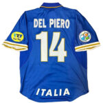 Blue Italy national team football jersey viewed from the back, showing the name 'DEL PIERO' and large number 14, with 'ITALIA' at the hem and patches on both sleeves (Fair Play on left, colorful emblem on right).