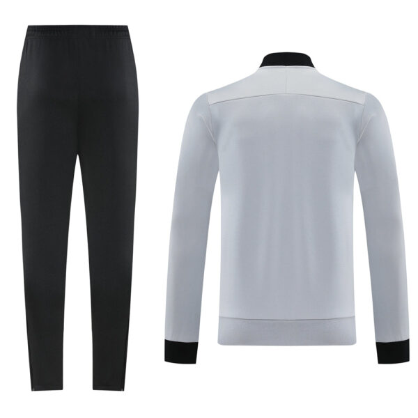 Women’s/men’s black athletic pants with a light gray jumper jacket featuring black cuffs and collar, shown full torso and legs.