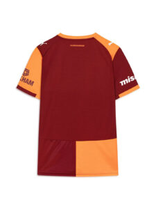 Back view of a color-blocked maroon and orange sports jersey with orange shoulder panels and sleeves, featuring white brand logos on the shoulders and sponsor text near the neckline.