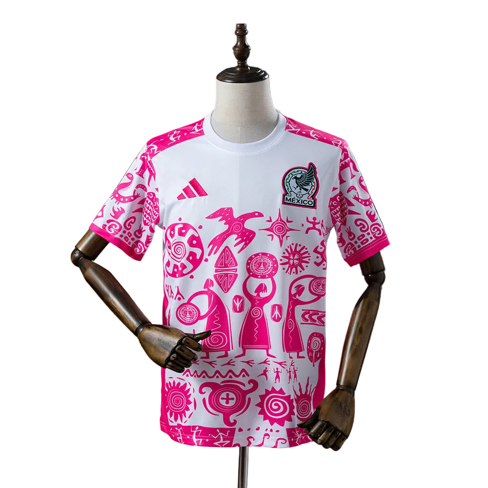 80a6c6d6 | UAE SPORT STORE White Mexico national soccer jersey with pink Aztec-like patterns, Adidas logo, and team crest on the chest, shown on a mannequin.