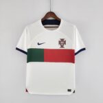 White soccer jersey on a hanger with Portuguese crest and a bold red-green front stripe; Nike swoosh on the chest edge.