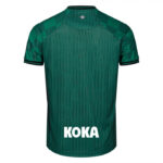 8267 | UAE SPORT STORE Back view of a green athletic jersey with a subtle vertical pattern, black-trimmed sleeves, a small crest at the neck, and the 'KOKA' sponsor text at the lower back.