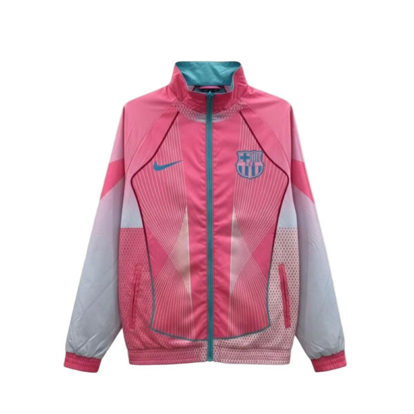 Pink FC Barcelona windbreaker with teal zipper and crest on the chest, featuring geometric design elements.