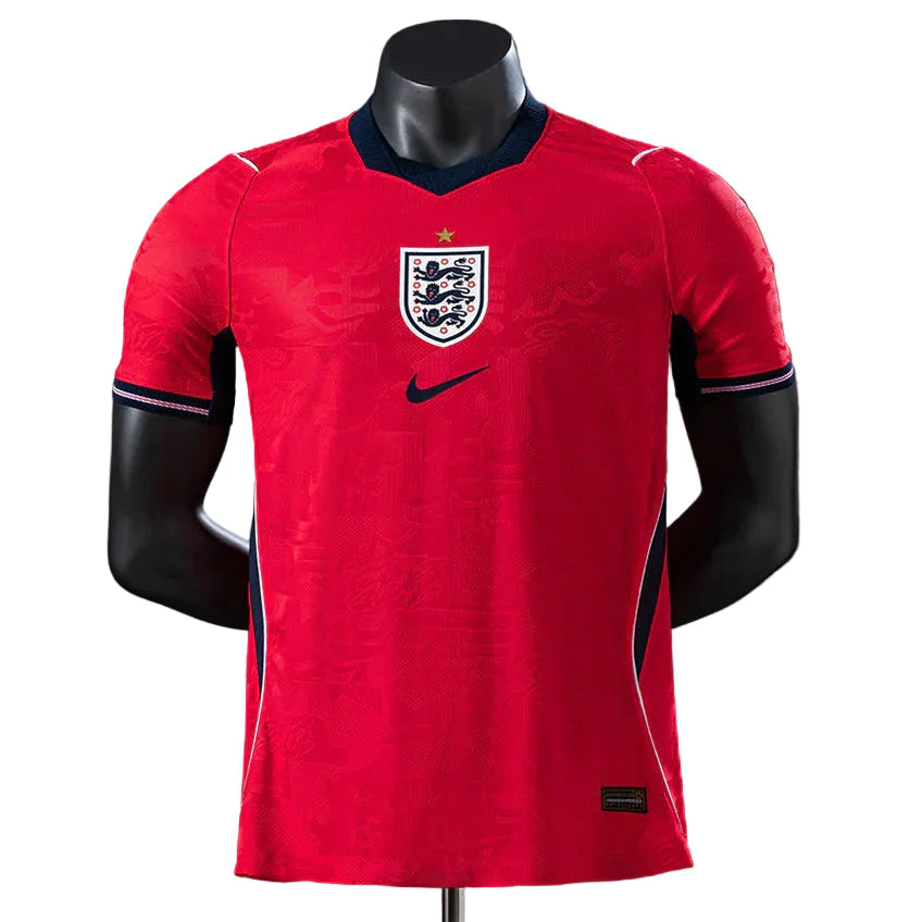 8340e333 | UAE SPORT STORE Red England national football team jersey with crest and Nike logo displayed on a mannequin, navy trim visible at the collar and sleeves.