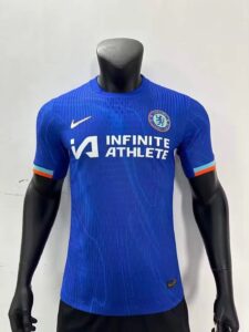 Blue Chelsea football jersey on a mannequin, sponsor logo 'INFINITE ATHLETE' and Nike swoosh visible.