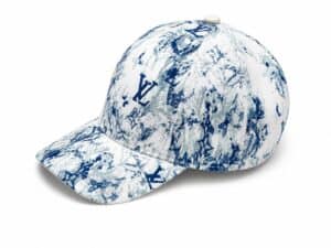 White baseball cap with a blue botanical print and LV logo accents