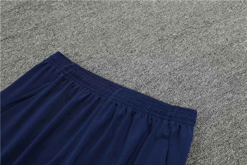 845430bf_1024x1024_2x_92ba347c-95ea-45fc-a253-24e780085f43 | UAE SPORT STORE Blue elastic-waist shorts laid flat on a gray carpeted surface