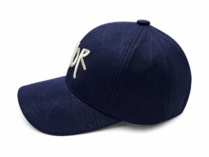 Navy blue baseball cap with white embroidered letters 'DR' on the front, pictured at an angle