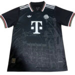 Dark soccer jersey with T-Mobile logo and Adidas stripes, featuring an architectural skyline graphic on the front.