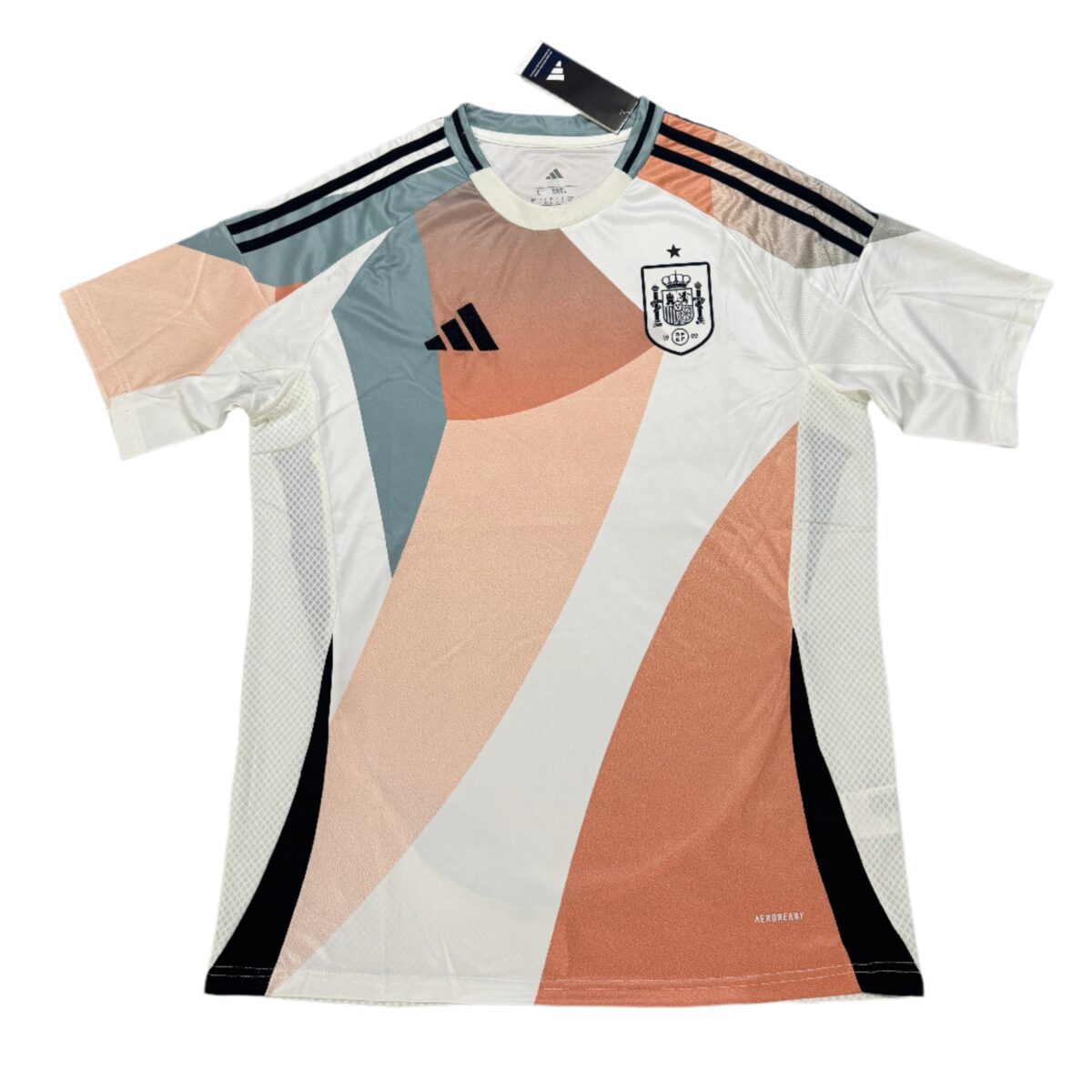 Spain national team jersey 2025, home kit with beige, white, black, and blue colors.