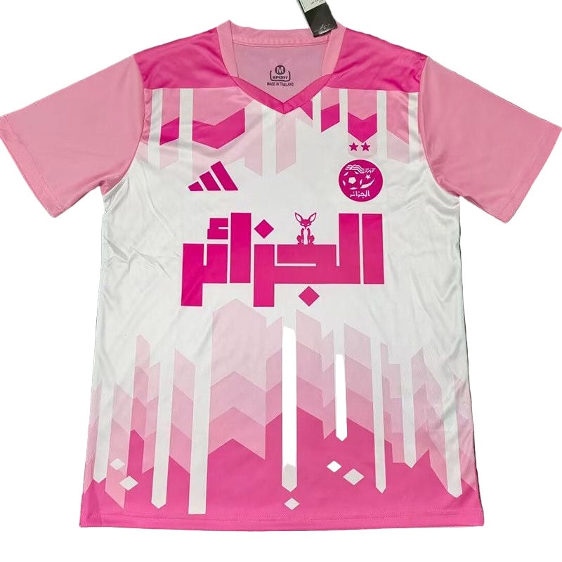 869a53c2-fba3-4724-8011-4f4ae747fcd5 | UAE SPORT STORE Pink and white soccer jersey with geometric pink pattern and Arabic text logo on the chest.