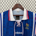 87477e29 | UAE SPORT STORE Blue Adidas football jersey on a hanger, white collar with red/blue trim, lace-up front, crest with a rooster and FFF letters on the chest, Adidas logo below.
