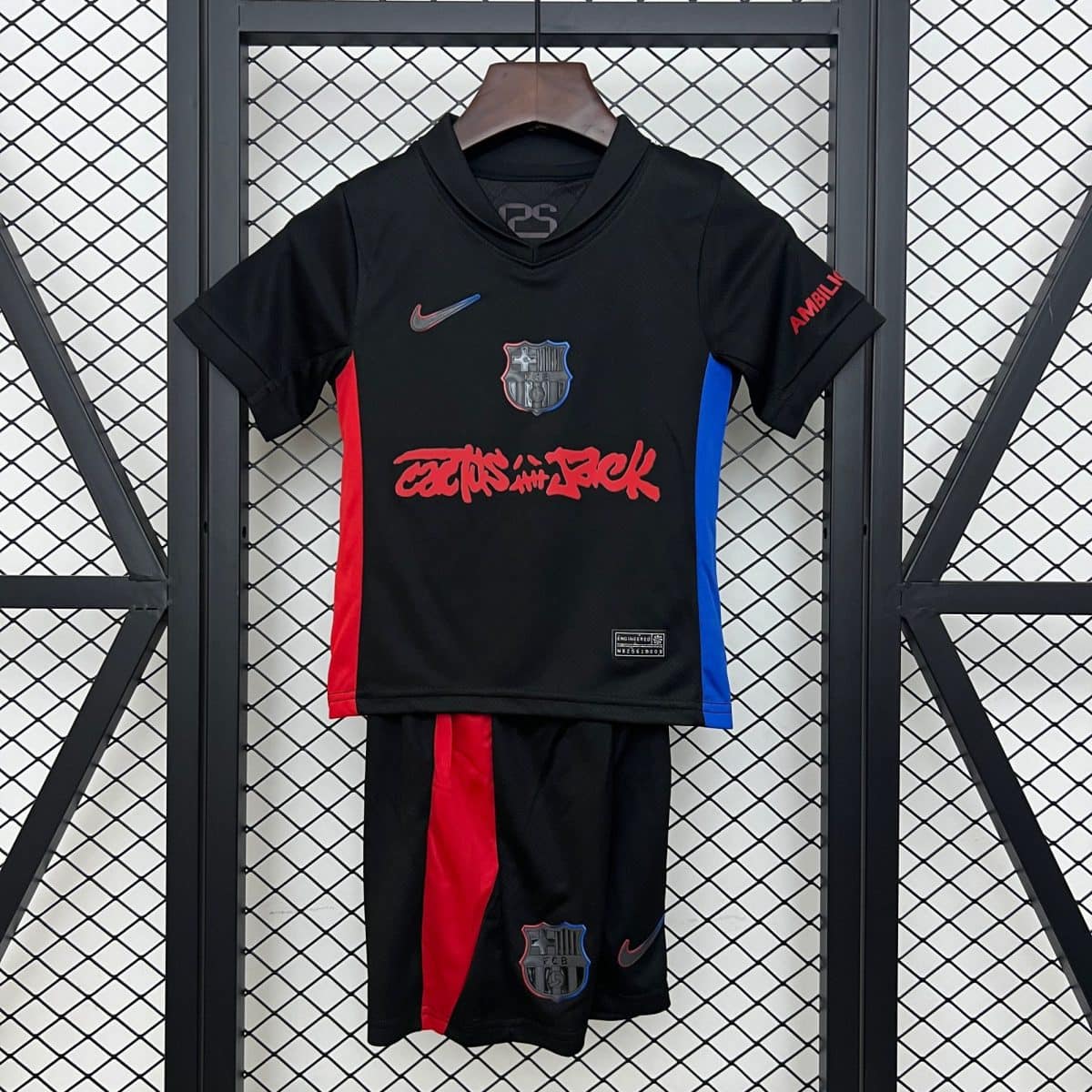 Black FC Barcelona soccer jersey on a hanger, with red center stripe, blue side panels, and Nike logo visible on front.
