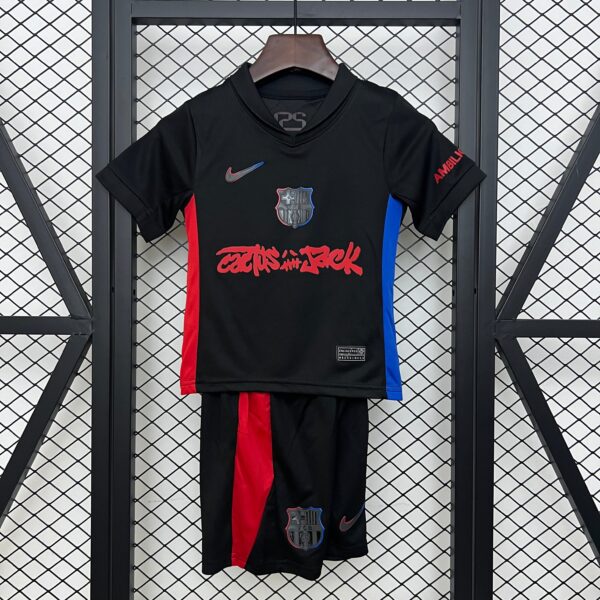 Black FC Barcelona soccer jersey on a hanger, with red center stripe, blue side panels, and Nike logo visible on front.