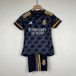 Real Madrid soccer jersey hanging on a wooden hanger, dark navy with Emirates sponsor and crest visible.