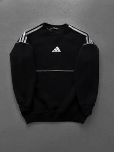 Black Adidas sweatshirt with white three-stripe details on shoulders and a small logo on the chest.
