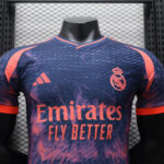 889ff70e | UAE SPORT STORE Real Madrid football jersey on a mannequin with a purple-pink pattern, crest on the chest and Emirates Fly Better sponsor text.