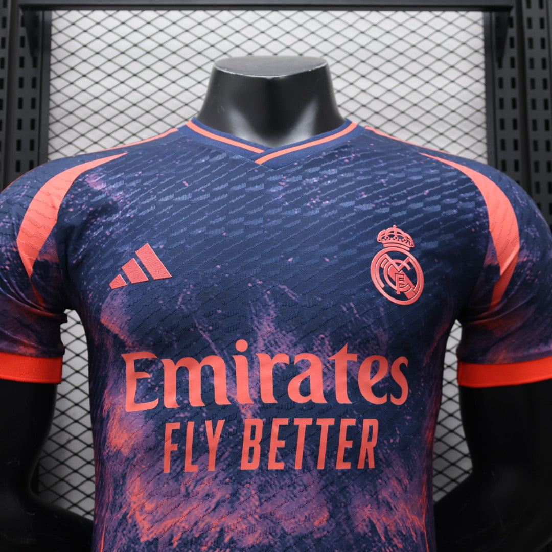 889ff70e | UAE SPORT STORE Real Madrid football jersey on a mannequin with a purple-pink pattern, crest on the chest and Emirates Fly Better sponsor text.