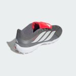 Grey athletic running shoe with a red padded tongue and white diagonal stripes along the side; white sole visible at the bottom edge.