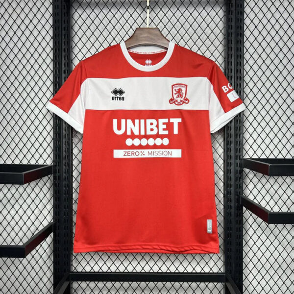Red and white soccer jersey hanging on a rack, featuring UNIBET sponsor and club crest on the chest.