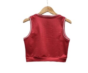 Red satin sleeveless crop top on a wooden hanger. No visible branding.