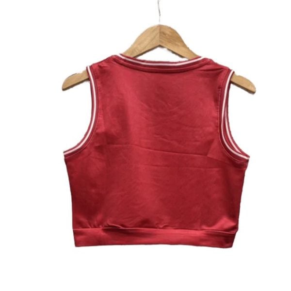 Red satin sleeveless crop top on a wooden hanger. No visible branding.