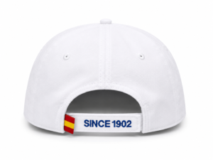 Back view of a white baseball cap with an adjustable strap reading 'SINCE 1902' and a small red-yellow tag on the side.