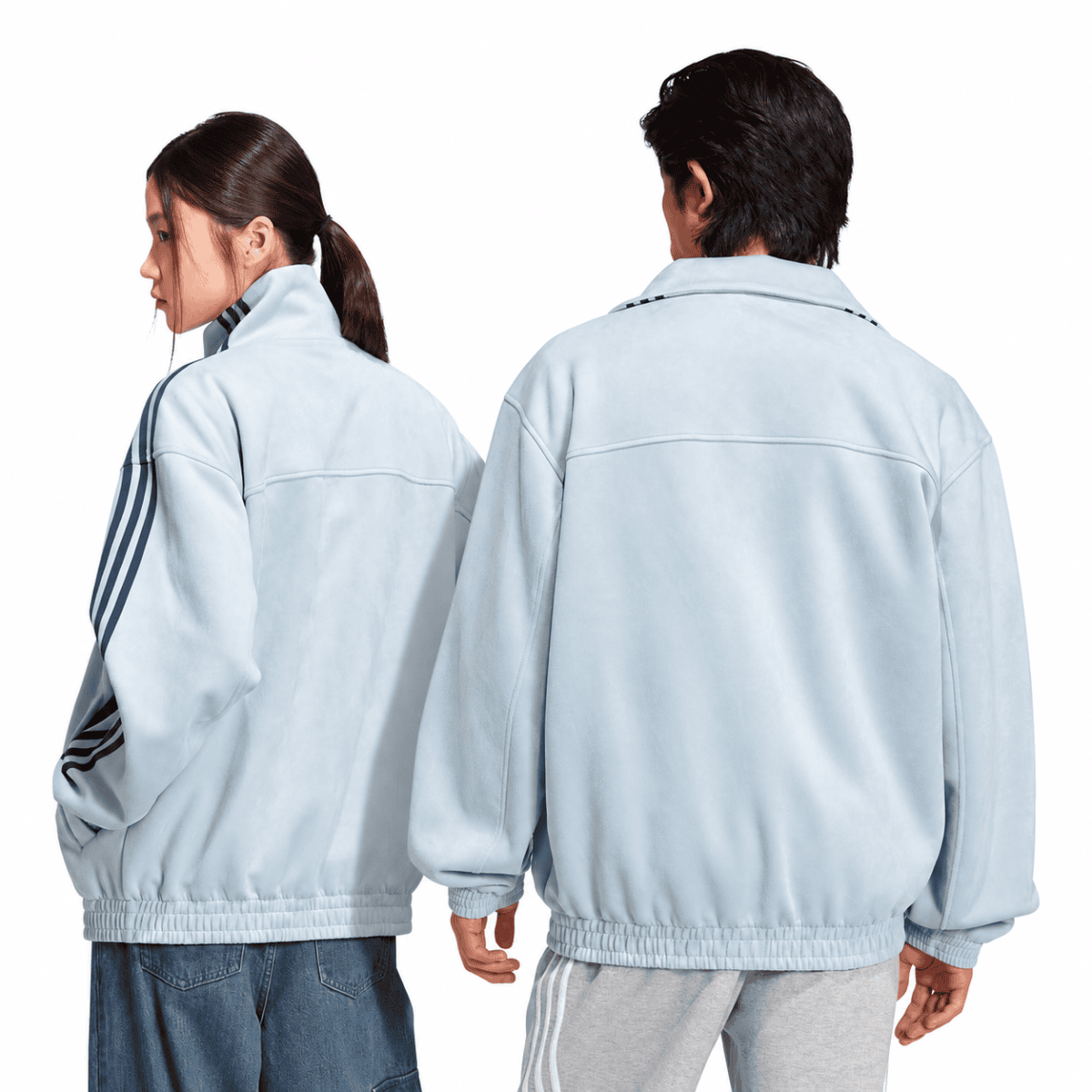 Light grey Adidas casual jackets worn by a man and woman, back view.