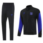 Black FC Barcelona training tracksuit: zipped jacket with blue sleeves and crest, paired with matching black pants.
