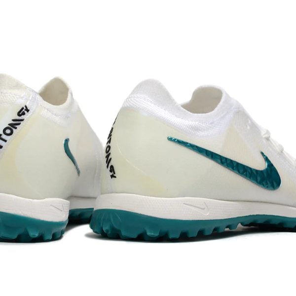 White Phantom GT sneakers with teal Nike Swoosh and teal outsole, rear view shown, on white background.”s