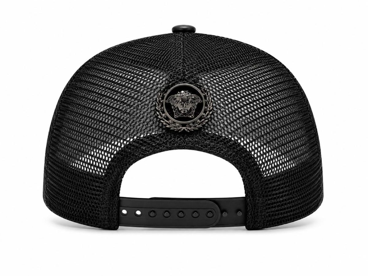 Black mesh trucker cap shown from the back with an adjustable strap and a round black emblem featuring a Medusa head at the center.