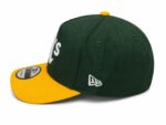 Green and yellow sports cap with "UAE" embroidery and New Era logo.