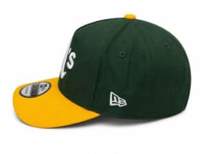 Green and yellow sports cap with "UAE" embroidery and New Era logo.