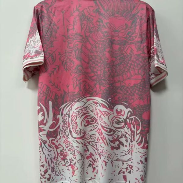 Pink short-sleeve shirt on a hanger with white striped collar; features large gray dragon graphic across the back and a gradient fading to white at the bottom.