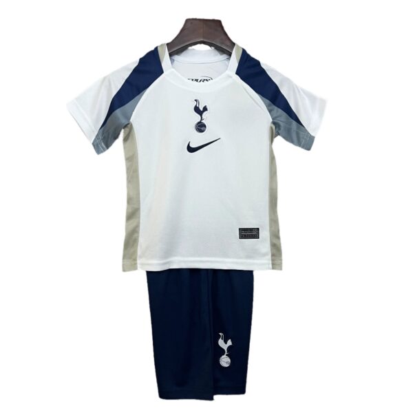 White Tottenham Hotspur football jersey on a hanger, featuring navy panels, Nike swoosh and club crest on the chest.