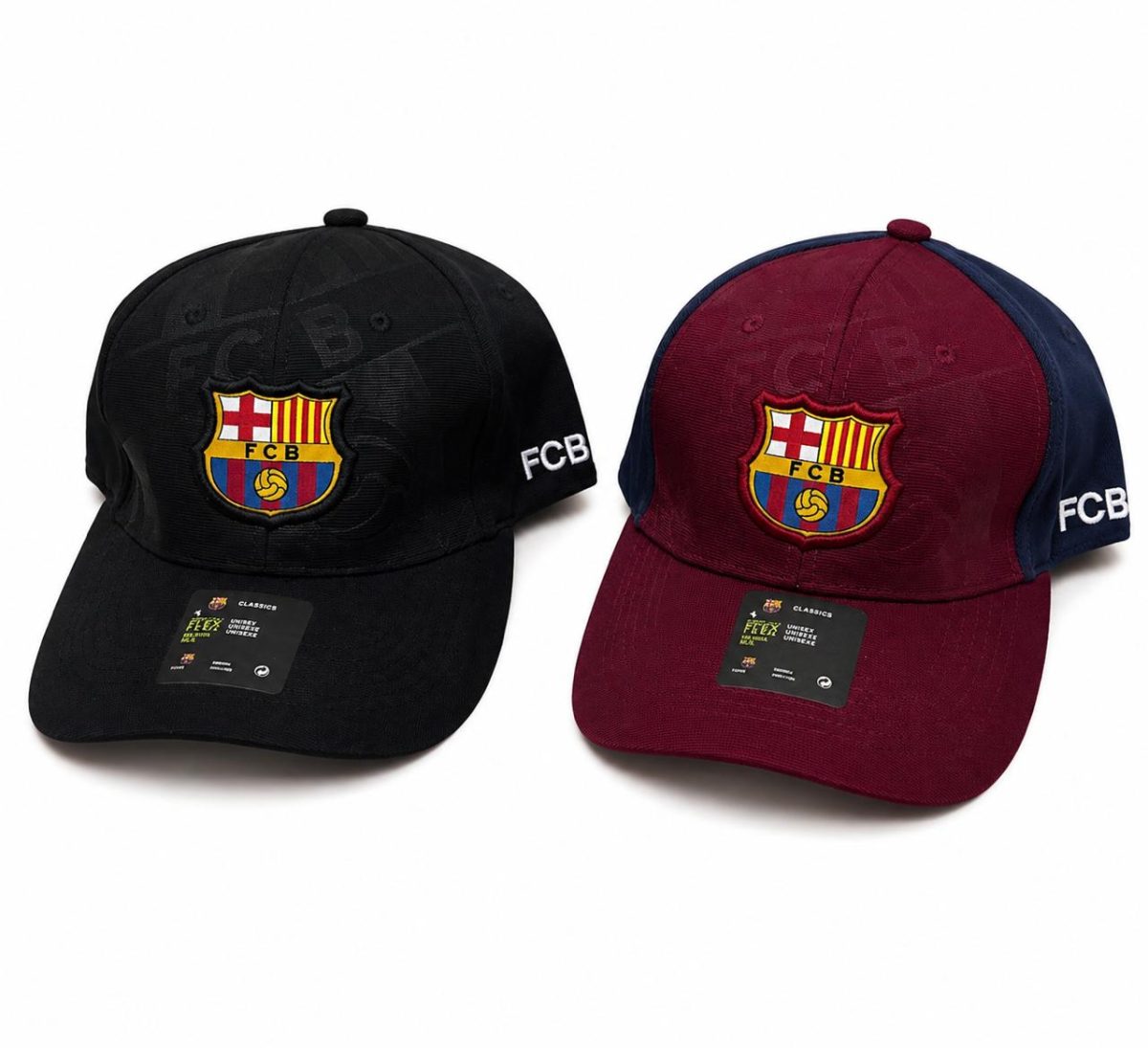 Two FC Barcelona caps, black and maroon, each with the club crest on the front and 'FCB' on the side.