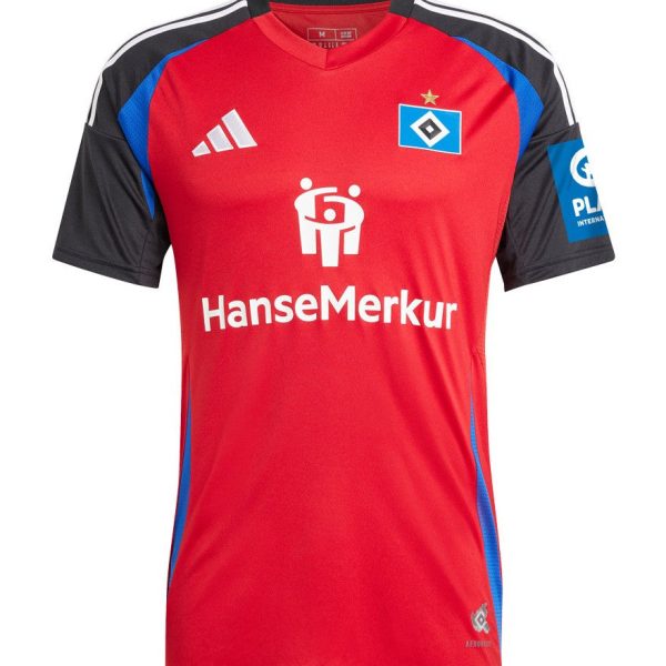 Red soccer jersey with black sleeves and blue side panels, featuring the HanseMerkur sponsor logo and a small club crest on the chest.