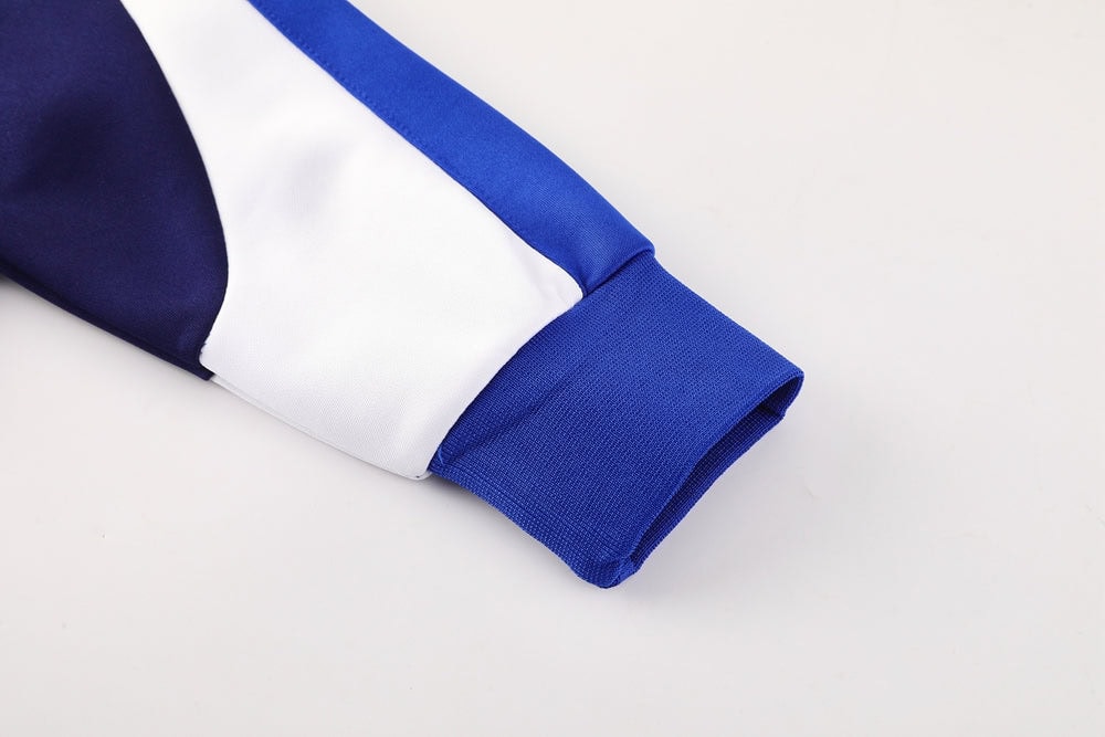 90b65ff3 | UAE SPORT STORE Close-up of a blue and white sports jersey sleeve cuff detail
