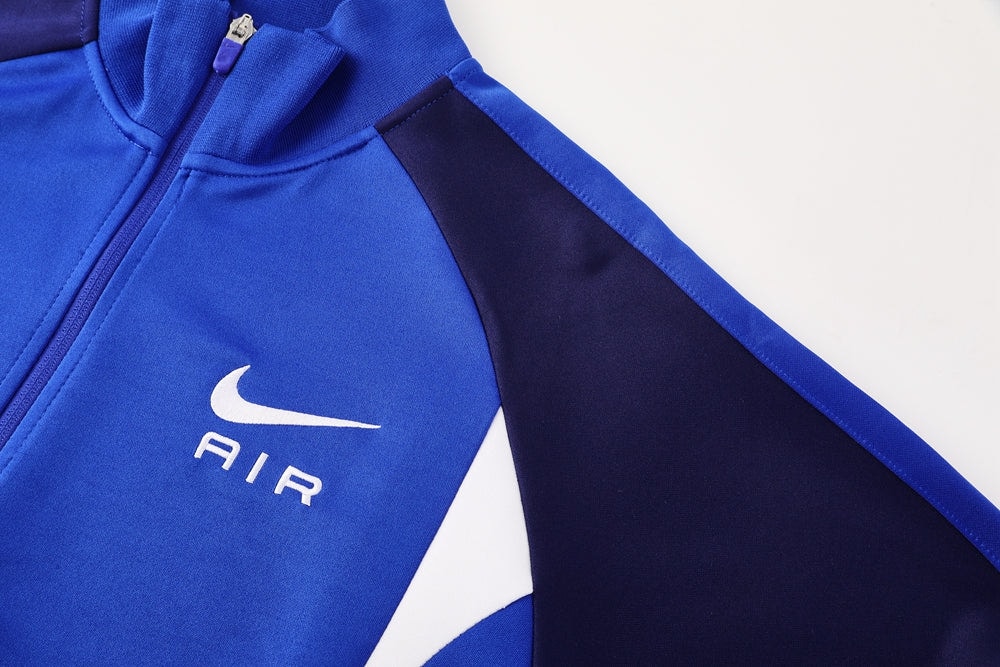 90fa0910 | UAE SPORT STORE Blue Nike Air zip-up jacket with a white swoosh and AIR logo on the chest.