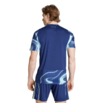 Back view of a man wearing a blue athletic jersey and matching shorts, with light blue swirl patterns on the sleeves and hem edges.