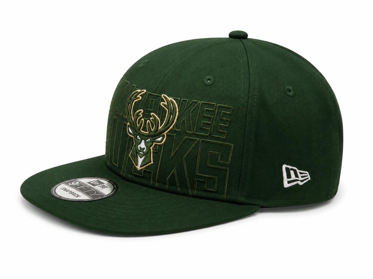 Green Milwaukee Bucks snapback cap with embroidered deer head logo and 'BUCKS' lettering on the front panel.