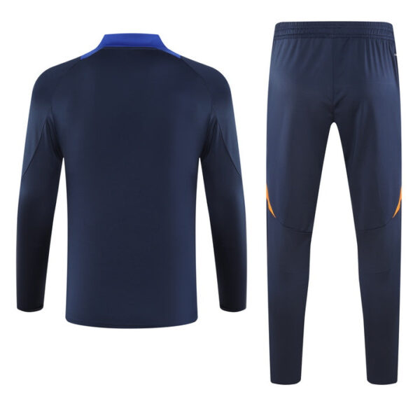 Navy blue athletic tracksuit top and matching pants shown from the back, with subtle orange accents on the knees/cides for a sporty set.