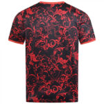 Back view of a black short-sleeve T-shirt with an all-over red ornate floral pattern.
