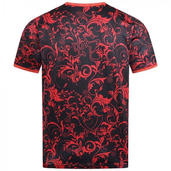 Back view of a black short-sleeve T-shirt with an all-over red ornate floral pattern.